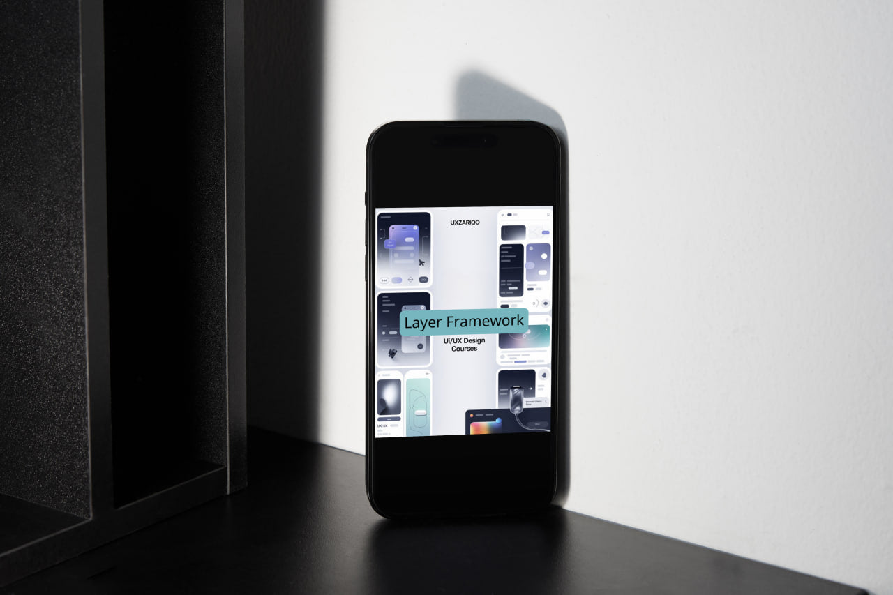 Smartphone displaying a user interface on a dark surface with a light gray background
